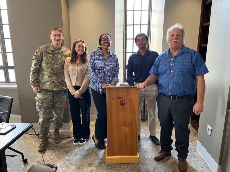 The team poses together after William Layton’s presentation. Pictured left to right: Alex Brandon, Lauren Armstrong, Anarra Williams, Christian Seeney, and William Layton